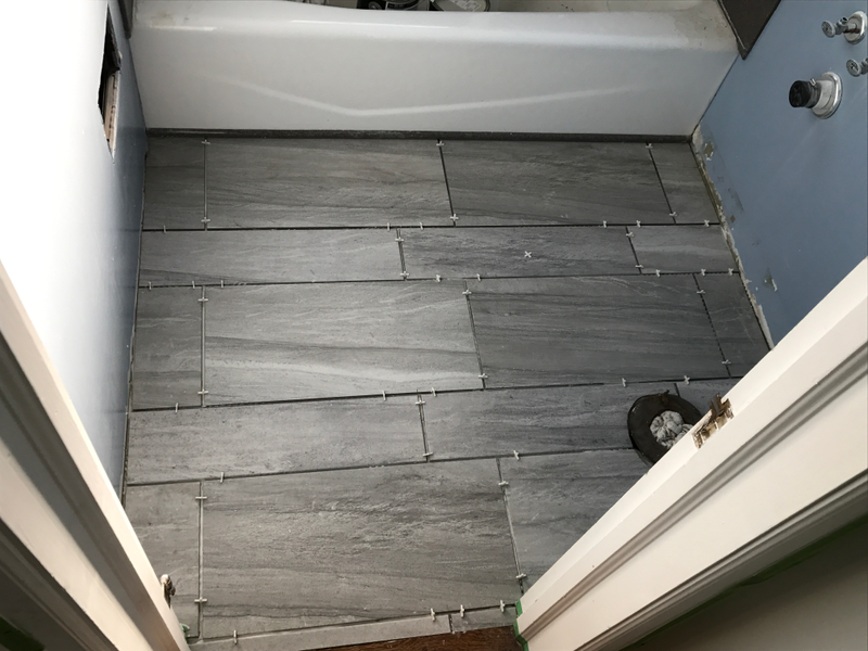 Bathroom floor! Just need to paint and then put the toilet and sink back in and it’s done.